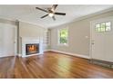 Bright living room boasts hardwood floors and a fireplace, creating a warm and inviting space at 1849 Broad Ave, Atlanta, GA 30344