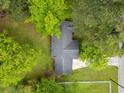 Aerial shot showcases the property's lush landscaping and mature trees at 3428 Quail Sw Run, Marietta, GA 30008