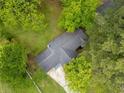 Aerial shot showcases the property's lush landscaping and mature trees at 3428 Quail Sw Run, Marietta, GA 30008
