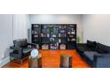 Cozy living room with stylish decor, dark bookshelves and comfortable seating at 1000 Admiral Xing, Alpharetta, GA 30005