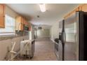 Kitchen with stainless steel appliances offering an open view to the living space, perfect for entertaining at 1013 Odelle Cir, Mcdonough, GA 30253