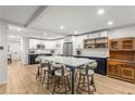 Spacious eat-in kitchen with large island, white cabinets, stainless appliances and a wine rack at 1105 Clairemont Ave # O, Decatur, GA 30030