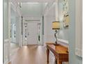 Inviting foyer with hardwood floors, high ceilings, and elegant trim details at 1210 Magnolia Park Cir, Cumming, GA 30040
