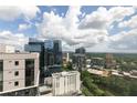 Stunning aerial view showcasing city buildings and lush green surroundings at 1280 W Peachtree Nw St # 3602, Atlanta, GA 30309