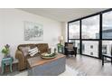 Comfortable living room featuring a city view and rustic-modern decor at 1280 W Peachtree Nw St # 3602, Atlanta, GA 30309