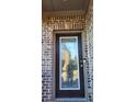 Stunning leaded-glass front door set in brick entryway of home at 4520 Essen Lane, Cumming, GA 30041