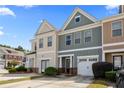 Charming townhome with a one-car garage and a well-maintained lawn at 2656 Avanti Way, Decatur, GA 30035