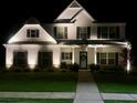 Elegant home exterior illuminated at night, showcasing its architectural details and curb appeal at 336 Parc Xing, Acworth, GA 30102