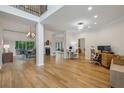 Open-concept home with hardwood floors, fireplace, and a seamless flow to the dining and office areas at 4735 Cambridge Trce, Atlanta, GA 30338