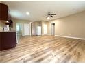 An open-concept living space with wood-look floors, neutral paint, and ample natural light at 4831 Oak Path, Stone Mountain, GA 30088