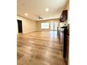 Living and dining area with an open concept layout, plus new vinyl floors and lots of light at 4831 Oak Path, Stone Mountain, GA 30088