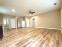 An open-concept living space with wood-look floors, neutral paint, and ample natural light at 4831 Oak Path, Stone Mountain, GA 30088