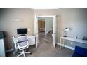 Bright office space with a desk, chair, neutral walls, and white trim with open view from french doors at 760 King Sword Ct, Mableton, GA 30126