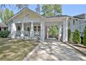 Charming home with a covered carport and a welcoming front porch with classic design elements at 78 Atlanta Se Ave, Atlanta, GA 30315