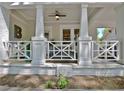 Close-up of a charming front porch with white columns and decorative railing, perfect for relaxing at 78 Atlanta Se Ave, Atlanta, GA 30315