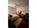 Comfortable bedroom features hardwood floors and a ceiling fan for a relaxing atmosphere at 200 Renaissance Ne Pkwy # 305, Atlanta, GA 30308