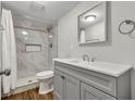 Elegant bathroom with a tiled shower, modern vanity, and neutral color scheme at 2184 Cherokee Valley Cir, Lithonia, GA 30058