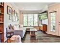 Relaxing living room featuring a comfortable gray sectional, TV, and lots of natural light at 955 Juniper Ne St # 4332, Atlanta, GA 30309