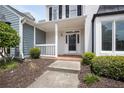 Charming covered front porch and well-kept landscaping welcome you home at 1002 Saddle Hl, Marietta, GA 30068