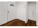 Bright entryway featuring beautiful dark hardwood floors and a traditional white door at 2584 Oldknow Dr, Atlanta, GA 30318