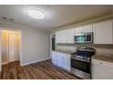 Bright kitchen featuring stainless steel appliances, granite countertops, and ample storage space at 4650 Big Valley Ct, Stone Mountain, GA 30083