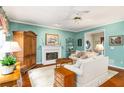 Comfortable living room with a fireplace, hardwood floors, and traditional decor creating a warm and inviting atmosphere at 3953 Lorien Nw Way, Kennesaw, GA 30152