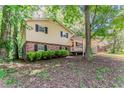 Traditional two-story home with brick accents and black shuttered windows at 4016 Nations Dr, Douglasville, GA 30135