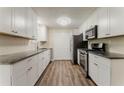 Updated kitchen featuring white cabinetry, sleek countertops, and stainless steel appliances at 4016 Nations Dr, Douglasville, GA 30135