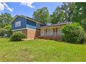 Charming two-story home with brick accents and lush green lawn at 4593 Bexley Way, Stone Mountain, GA 30083