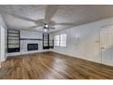 Bright living room with hardwood floors and stylish fireplace at 4593 Bexley Way, Stone Mountain, GA 30083