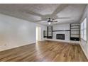 Bright living room with hardwood floors and stylish fireplace at 4593 Bexley Way, Stone Mountain, GA 30083