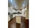Bright kitchen featuring white cabinets, a granite island, and stainless steel appliances at 2431 Kingston Heath Way, Marietta, GA 30008