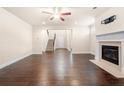 Inviting living room with fireplace, hardwood floors, and staircase access at 2431 Kingston Heath Way, Marietta, GA 30008
