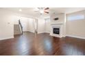 Spacious living room featuring hardwood floors and a cozy fireplace at 2431 Kingston Heath Way, Marietta, GA 30008