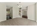 Open-concept dining room with modern lighting and neutral color scheme at 3570 Steve Nw Dr, Marietta, GA 30064