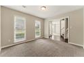 Bright living room featuring neutral paint, large windows, and plush carpet at 3570 Steve Nw Dr, Marietta, GA 30064