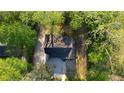Birds-eye view of the house showcasing the roof and surrounding lush trees at 2228 Emory St, Covington, GA 30014