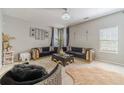 Stylish living room with modern furniture, plush rugs, and bright, natural light at 4023 Port Springs Trl, Snellville, GA 30039