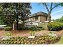 Stone Manor Sandy Springs community sign with lush greenery at 6980 Roswell Road # A8, Atlanta, GA 30328