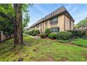 Brick townhouses with beautiful landscaping and green lawns at 6980 Roswell Road # A8, Atlanta, GA 30328