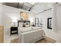 Beautifully staged bedroom with natural light, neutral colors, and sleek decor providing a calming atmosphere at 881 Memorial Se Dr # 307, Atlanta, GA 30316
