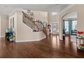 Welcoming foyer with hardwood floors, an elegant staircase, and plenty of natural light at 4060 Brumby Ln, Cumming, GA 30041