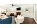 Cozy living room with hardwood floors, fireplace, and modern furnishings at 511 Pine Springs Se Trl, Marietta, GA 30067