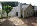 Backyard showcases a stone patio and a privacy fence perfect for entertaining at 1132 Britley Park Ln Ln, Woodstock, GA 30189