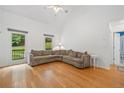 Bright living room featuring hardwood floors, high ceilings, and natural light at 3310 Southlake Ln, Cumming, GA 30041