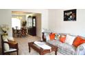 Open-concept living and dining area, with neutral carpet and furniture at 4450 Ivy Fork Dr, Loganville, GA 30052
