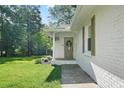 Inviting entrance featuring a charming front porch and well-maintained landscaping at 2110 Argyle Se Dr, Smyrna, GA 30080