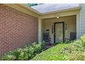 Inviting covered front porch with rocking chairs and a well-maintained landscape, perfect for relaxing at 1236 Whitlock Ridge Sw Dr, Marietta, GA 30064