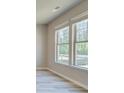 A side view of the home showing the large windows and the view of the property at 162 Haverling Pass, Hampton, GA 30252