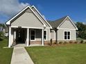 Beautiful single-Gathering home with a charming front porch and landscaped front yard at 241 Saratoga Dr, Acworth, GA 30102